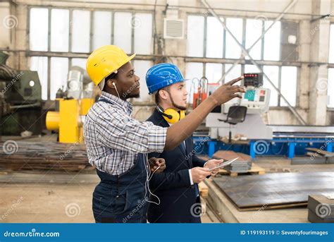Engineers Discussing Factory Machine Stock Image Image Of Examining