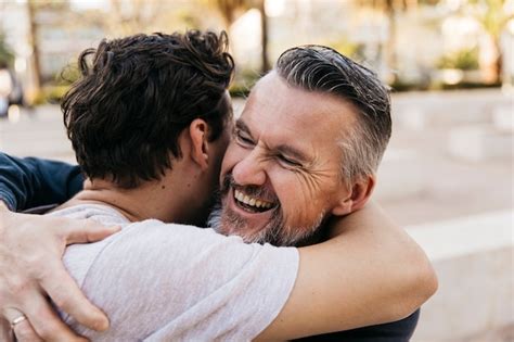 Joyful Father And Son Hugging Photo Free Download