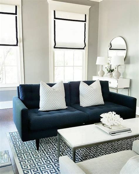 It pairs with navy blue accents in the stripes, pillows, and window treatments to achieve balance. Navy Blue Tufted Sofa with Blue Greek Key Rug ...
