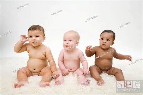 Three Naked Babies Sitting In A Row Stock Photo Picture And Royalty