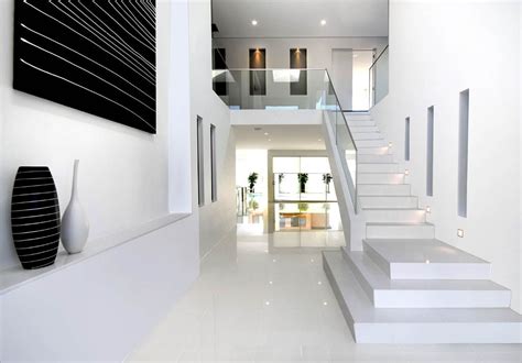 A tile floor in a basement allows for the easy cleanup and durability that are necessities for many homeowners when finishing a basement. #modern home #white Karlson Homes caesar stone floor tiles ...