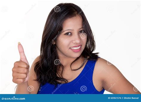 Girl Showing Thumbs Up For Success Victory And Best Luck Stock Photo