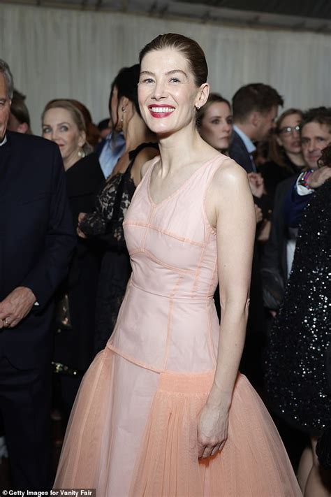 Rosamund Pike Cuts An Elegant Figure In A Glamorous Pink Gown As She
