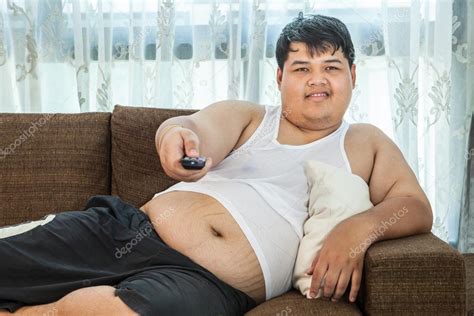 Overweight Guy Sitting On The Couch To Watch Some Tv — Stock Photo