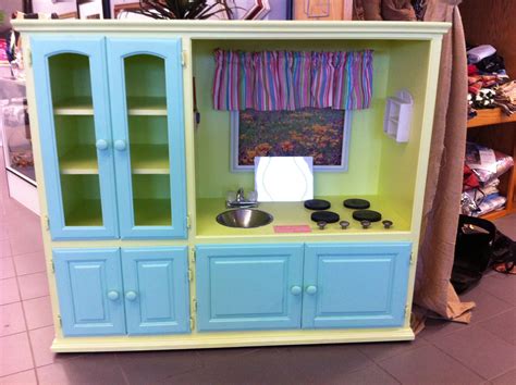 See what i mean.this first one was lovingly converted into a cute little red and white kitchen by milla's grandma and grandpa. Play kitchen made out of old entertainment center. Saw ...
