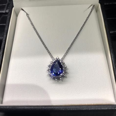 Tanzanite Pear Shape With A Halo Of Diamonds Stunning Piece For A