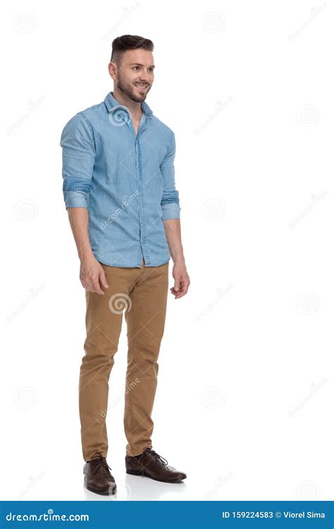Casual Man Standing And Looking Ahead Happy In Side View Stock Image