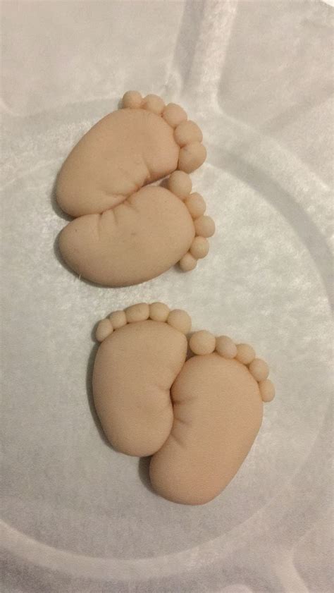 Two Cookies Shaped Like Feet On A Plate
