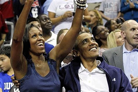 video barack obama and wife michelle share big screen kiss at us basketball game london