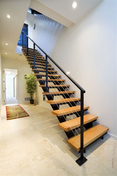 This Modern Staircase Has A Metal Frame With Natural Wood Treads The