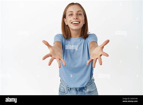 Beautiful Blond Girl Reaching Hands Stretching Out Arms To Receive