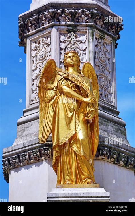 Gold Angel Statue On The Holy Mary Monument Column Beside Zagreb