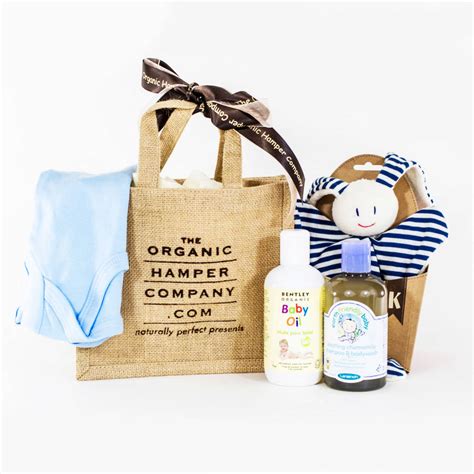 Baby hampers are described as baskets full of baby gifts, such as bibs, bottles, onesies, toys, food, and flowers. new baby gift bag by the organic hamper company ...