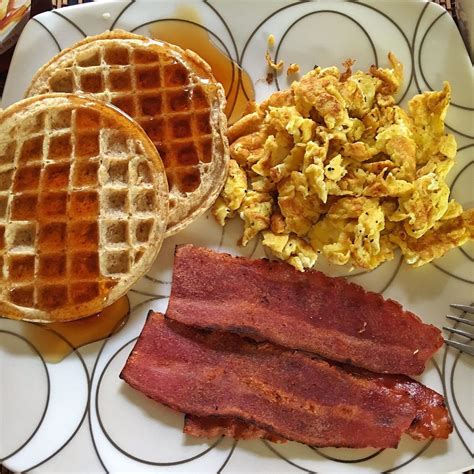 Whole grain waffles with lite syrup, scrambled eggs and ...