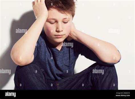 Sad Young Boy Sitting Thinking Hi Res Stock Photography And Images Alamy