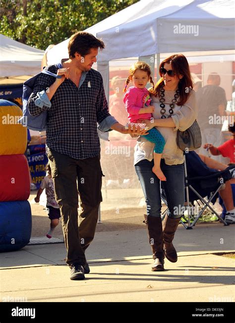 pregnant alyson hannigan and husband alexis denisof and daughter satanya denisof at a farmers