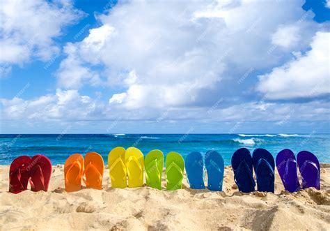 Premium Photo Colorful Flip Flops On The Sandy Beach