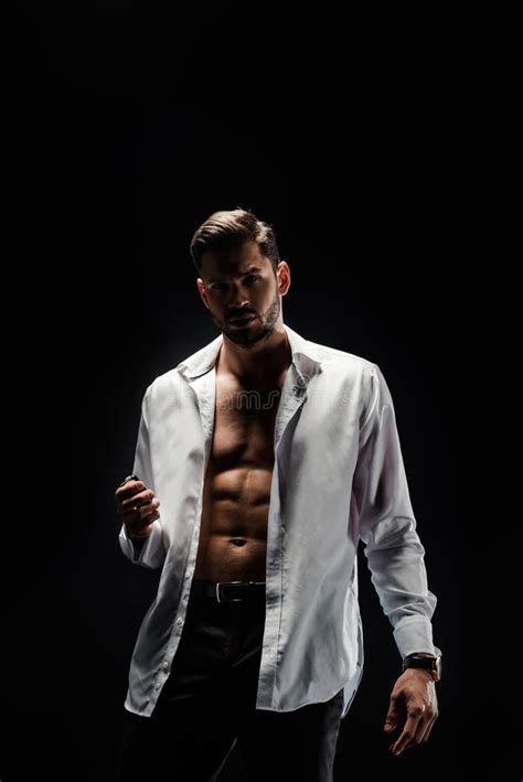 Sexy Muscular Man In White Unbuttoned Shirt Looking At Camera Stock