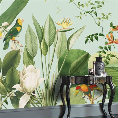 The Wallpaper In This Room Is Painted With Tropical Flowers And Birds