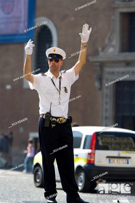 Traffic Policeman Directing Traffic In Rome Italy Stock Photo