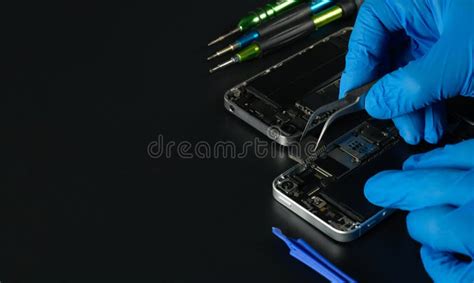 Technician Repairing The Cell Phone Parts And Tools For Recovery Repair