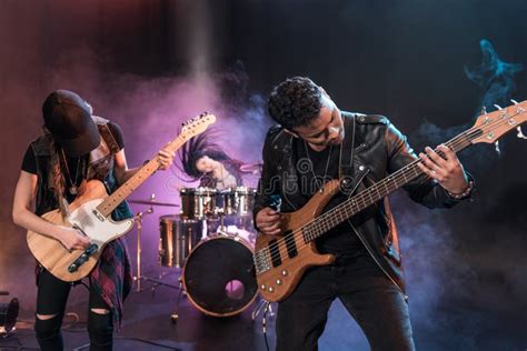 Rock And Roll Band With Electric Guitars Playing Hard Rock Music Stock
