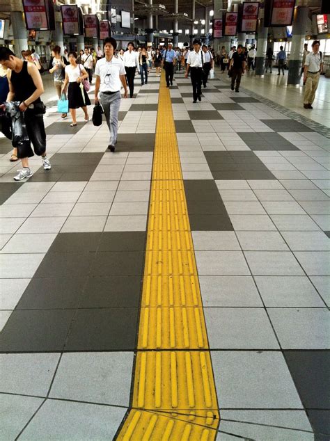 In Japanyellow Raised Grooved Lines On Sidewalks Are A Form Of Street