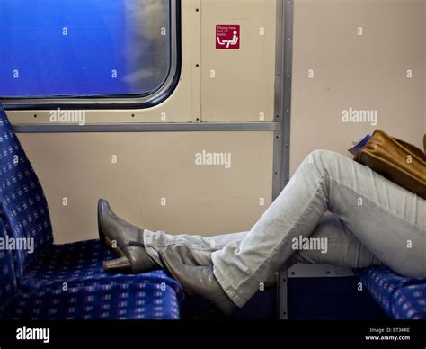 Woman With Feet On Train Carriage Seat Stock Photo Alamy