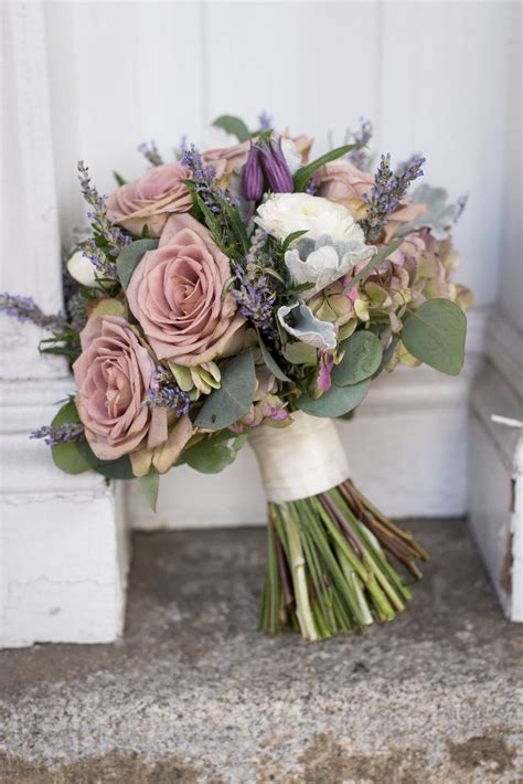 love the muted vintage tones of rose lavender and sage green in this beautiful bridal bouque