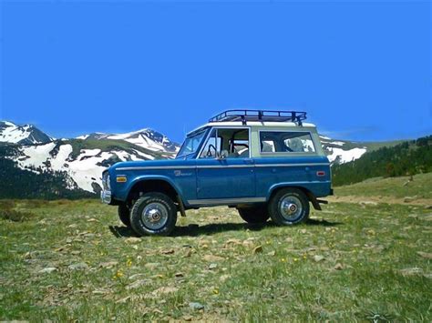 Nice Blue Bronco With A Rack And Mountains In The Background Old Ford