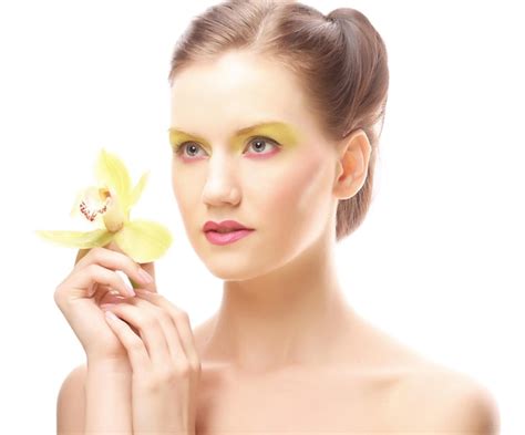Premium Photo Young Woman With Bright Make Up Holding Orchid