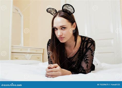 Young Pretty Brunette Woman Wearing Lace Mouse Ears Laying Waiting