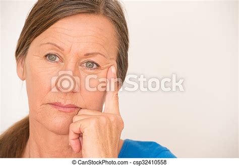 thinking mature woman sad look portrait lonely attractive mature woman worried stressed