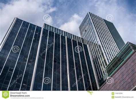 Bottom View Of Facades Of Modern Glass Office High Rises Against Blue