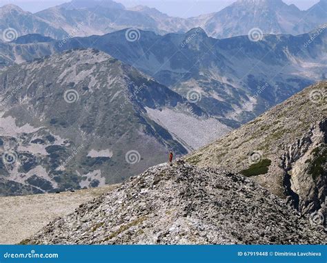 Young Woman In Rocky Mountain Stock Photo Image Of Conquering