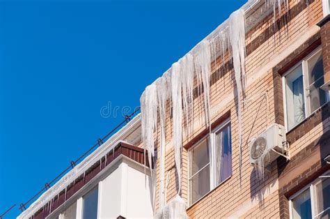 Roof Of The House With Snow And Icicles Overhanging Stock Image Image
