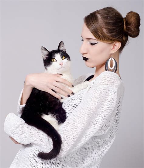 female pose reference holding a cat