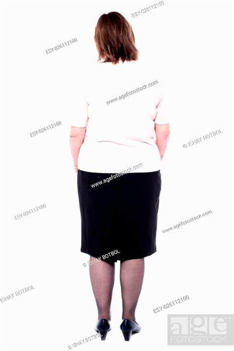 Back Pose Of A Senior Woman Facing The Wall Stock Photo Picture And