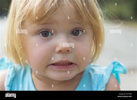 Adorable Little Girl Making Disgusted Or Surprised Face Stock Photo Alamy