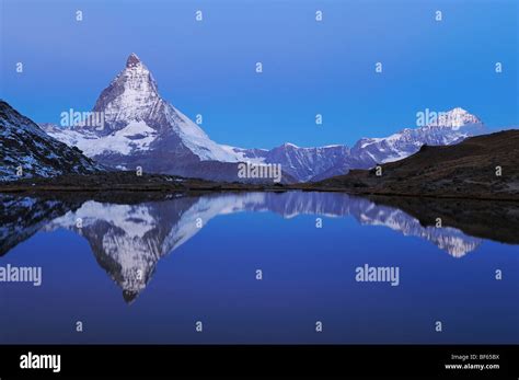 Matterhorn At Sunrise In Winter With Reflection In The Riffelsee