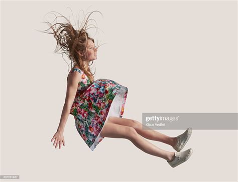 Woman In Dress In The Air Falling Down Photo Getty Images