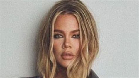 khloe kardashian goes completely topless under a leather jacket and shows off her long legs in