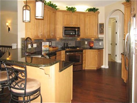 Honey oak cabinets with white tiled countertops. 66 best images about Dark or Light wood floors/Table ideas ...