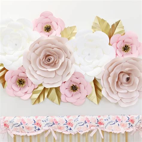 Making your own wall art is so much easier than you think. blush white and gold large paper wall flowers for nursery ...