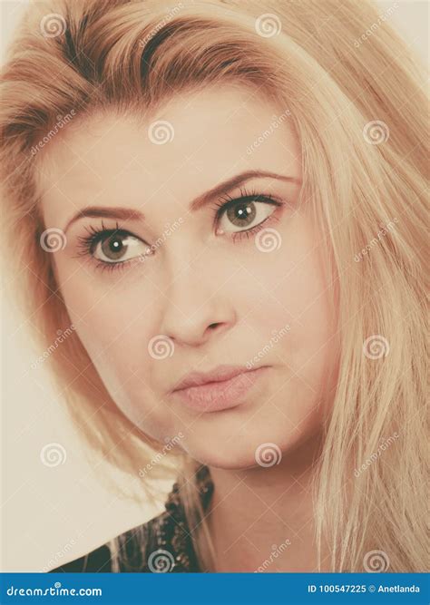 Portrait Of Blonde Woman With Serious Face Expression Stock Image