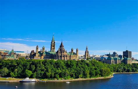 4k00:06clock tower spire at parliament hill building in ottawa ontario canada with canadian flag flying in summer. Ottawa's Parliament Hill - SnowBoulder | Moments of Landscapes