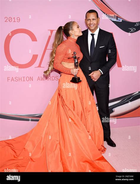 Fashion Icon Award Honoree Jennifer Lopez Left Poses With Her Fiancé