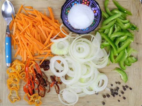 Chop garlic, onion, scallion, thyme, tomatoes and pepper (please. How to make Jamaican Escovitch Sauce.