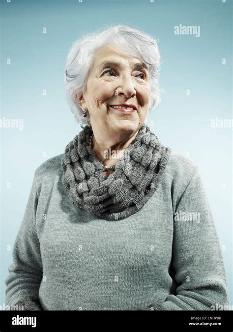 An Elegant Senior Woman Smiling And Looking Away Stock Photo Alamy