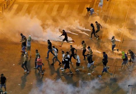 Riot Police Use Water Cannons And Tear Gas As Thousands Of Expat